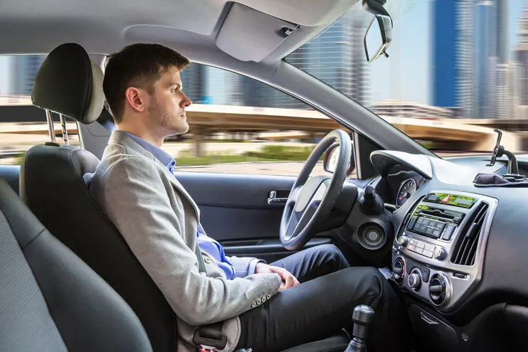 Man sitting in an autonomous car
