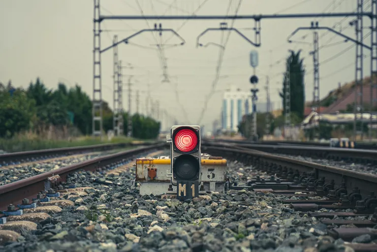 Red stop light on railway tracks