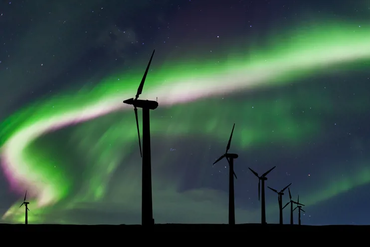 Wind turbines on the background of the Northern Lights