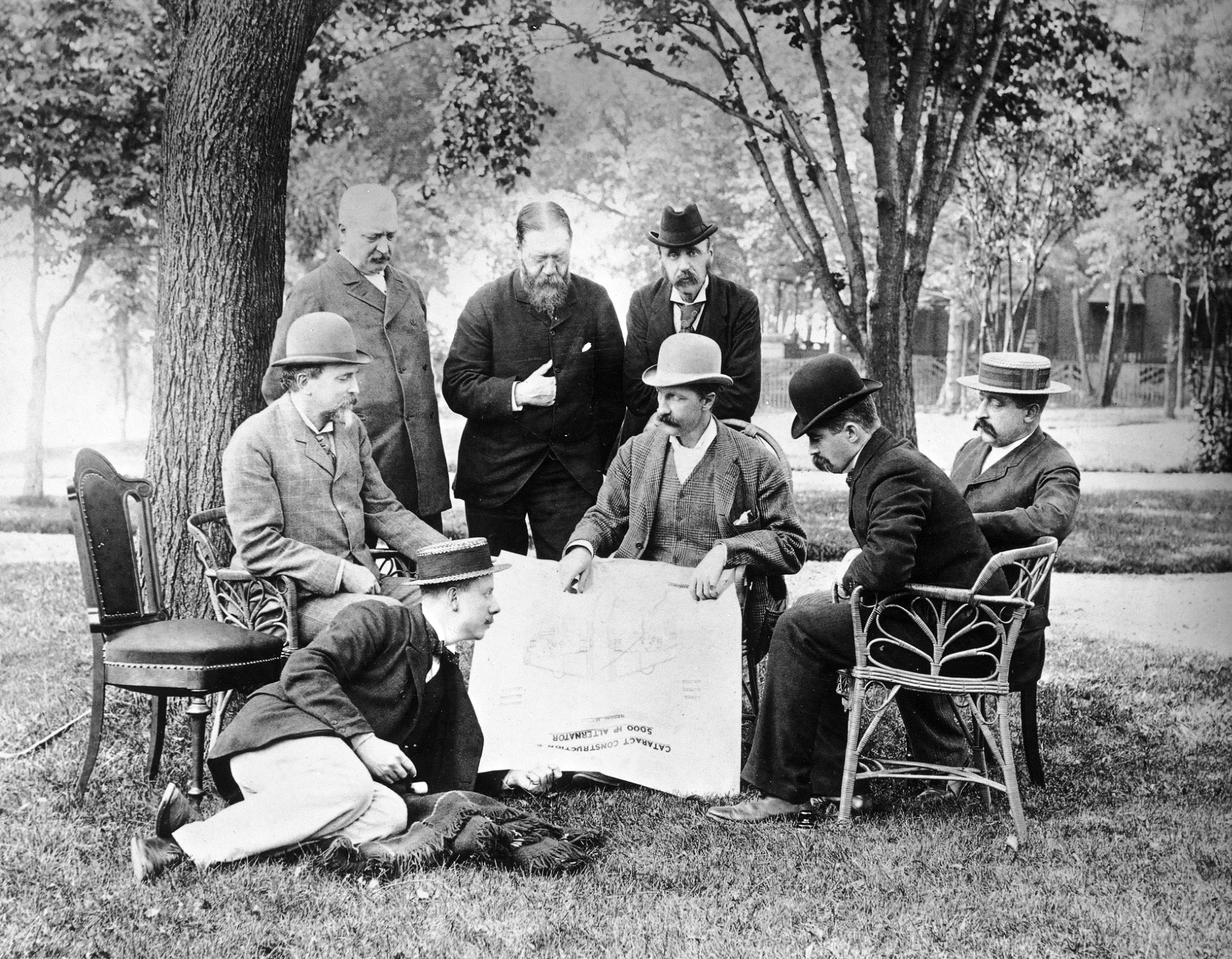 Sir William Henry Preece (standing, centre) with engineers discussing the Niagara Falls Power Scheme c 1895 ref. Image 1/1/0383.04