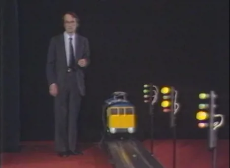 Film still from the 1982 Faraday Lecture showing the model train.